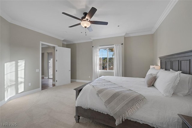 carpeted bedroom with a ceiling fan, crown molding, and baseboards