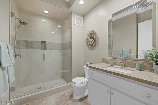 full bathroom with visible vents, toilet, vanity, a shower stall, and recessed lighting