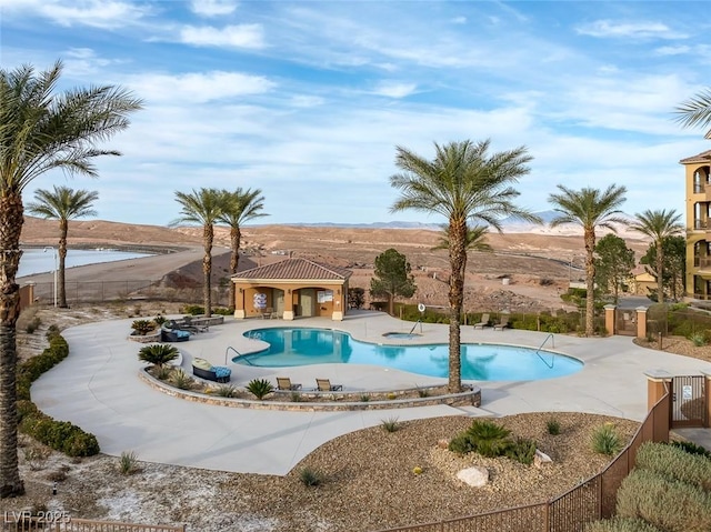 pool with a patio area, fence, and a gazebo