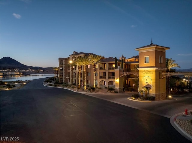 view of property with a water and mountain view