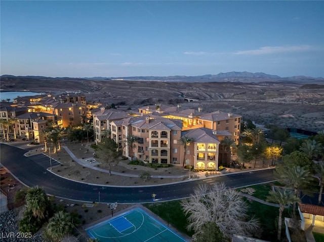 birds eye view of property featuring a mountain view