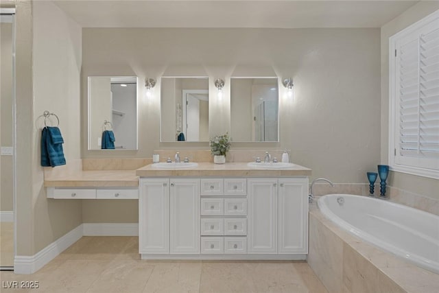 bathroom with a bath, double vanity, walk in shower, and a sink