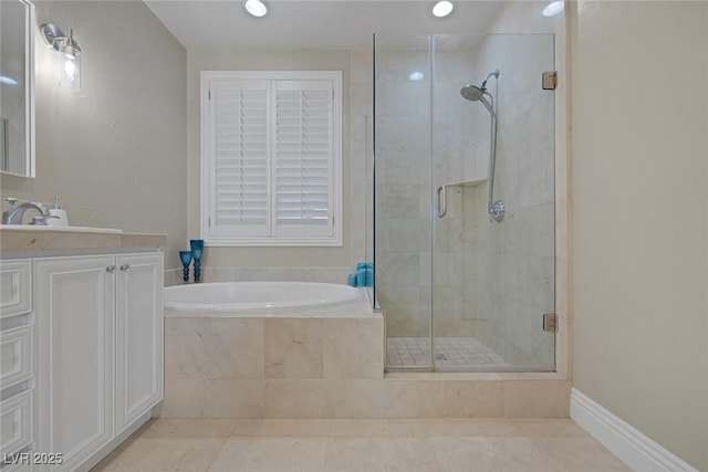 bathroom with tile patterned flooring, a garden tub, a shower stall, and vanity