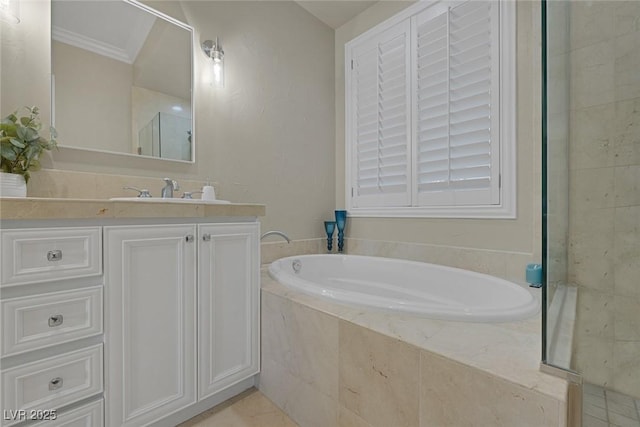 full bathroom featuring a shower, a garden tub, crown molding, and vanity