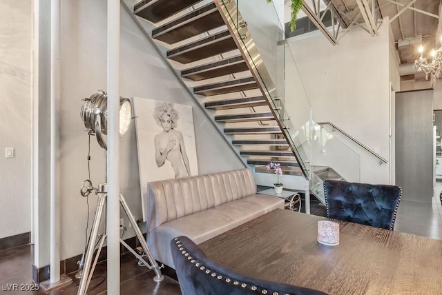 staircase featuring a towering ceiling