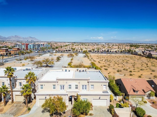 birds eye view of property with a mountain view