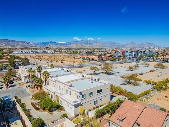 birds eye view of property featuring a mountain view