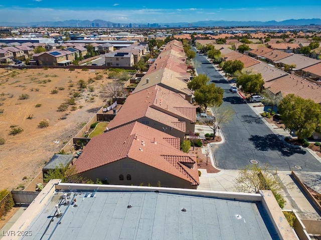 birds eye view of property featuring a mountain view and a residential view