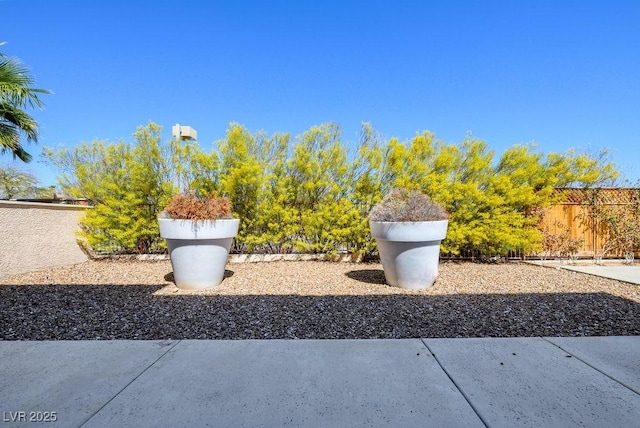 view of yard featuring a patio area and fence