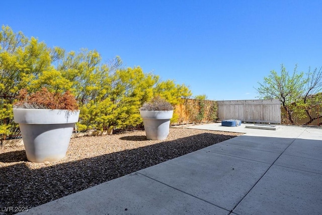 view of patio / terrace featuring fence