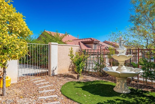 exterior space with a gate and fence