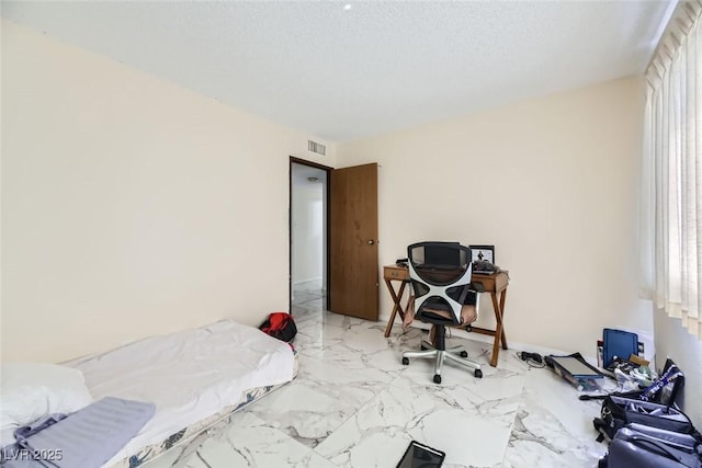 bedroom with a textured ceiling, marble finish floor, multiple windows, and visible vents