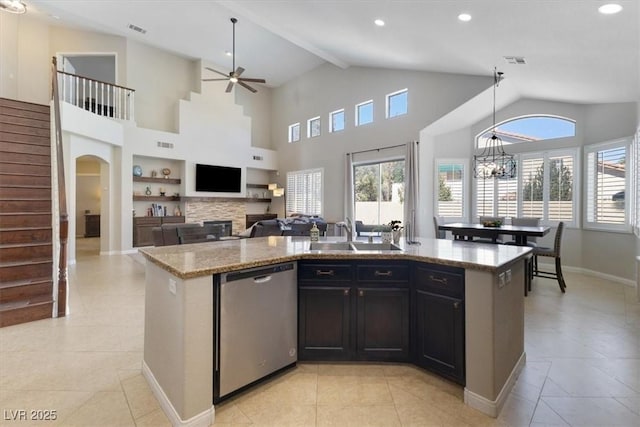 kitchen with a sink, visible vents, dishwasher, and light tile patterned flooring