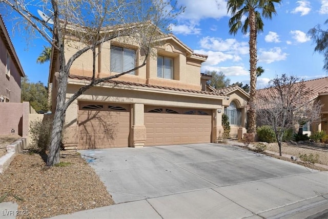 mediterranean / spanish-style house featuring a garage, a tiled roof, concrete driveway, and stucco siding