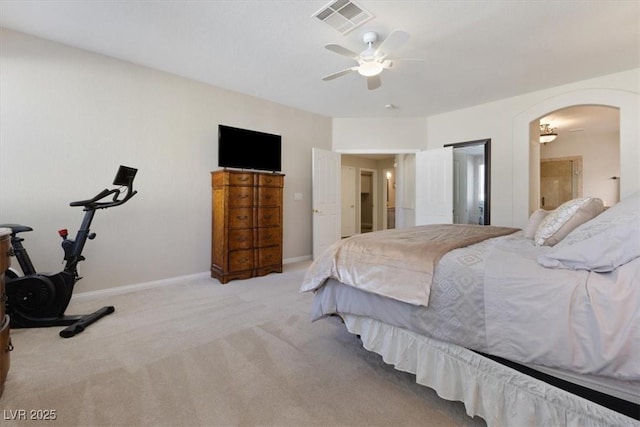 bedroom featuring arched walkways, visible vents, a ceiling fan, carpet flooring, and baseboards