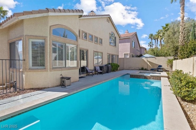 view of pool featuring a fenced in pool, a patio area, and a fenced backyard