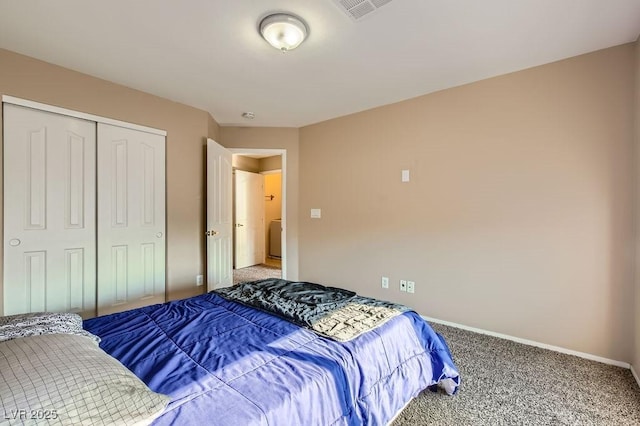 bedroom with baseboards, visible vents, carpet floors, and a closet