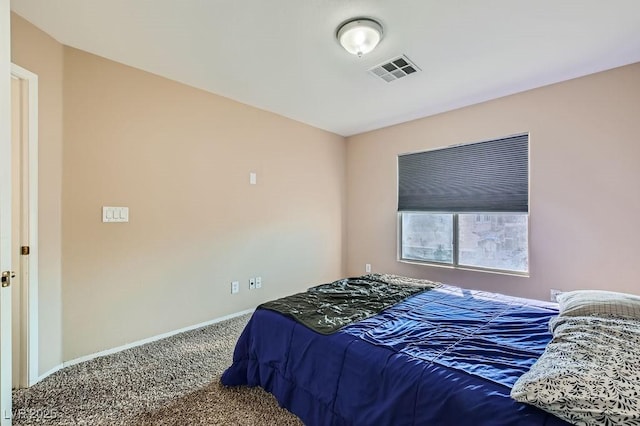 bedroom featuring visible vents, baseboards, and carpet floors