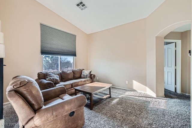 living area with visible vents, baseboards, lofted ceiling, carpet floors, and arched walkways