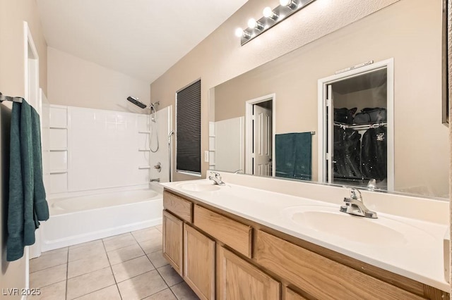 full bath featuring a sink, shower / bathtub combination, double vanity, and tile patterned floors