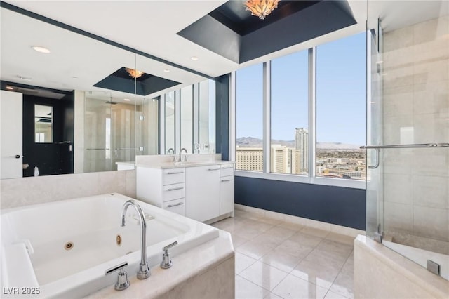 full bath with a jetted tub, a shower stall, tile patterned flooring, baseboards, and vanity