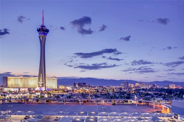 exterior space with a city view and a mountain view