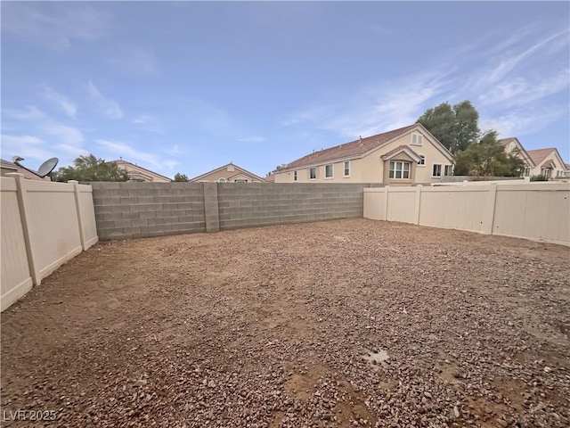 view of yard with a fenced backyard