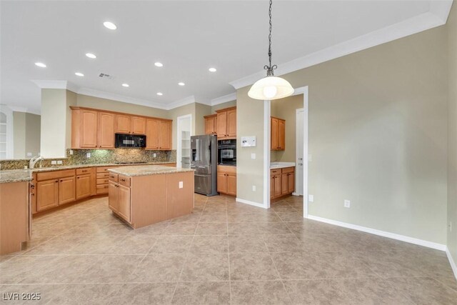 kitchen with a center island, backsplash, black appliances, and crown molding