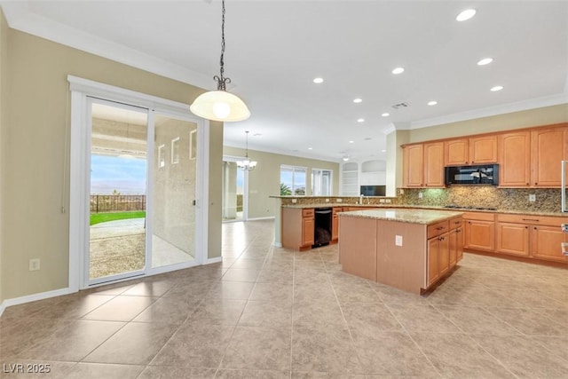 kitchen featuring black appliances, light stone counters, plenty of natural light, and backsplash