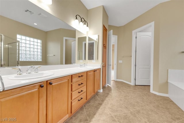 full bathroom with a sink, a bath, double vanity, and tile patterned flooring