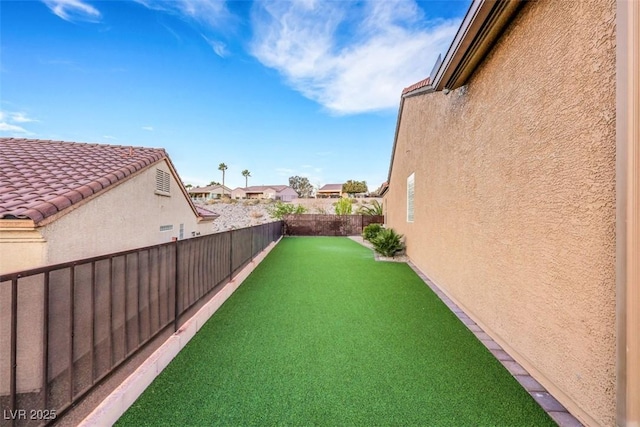 view of yard featuring a fenced backyard