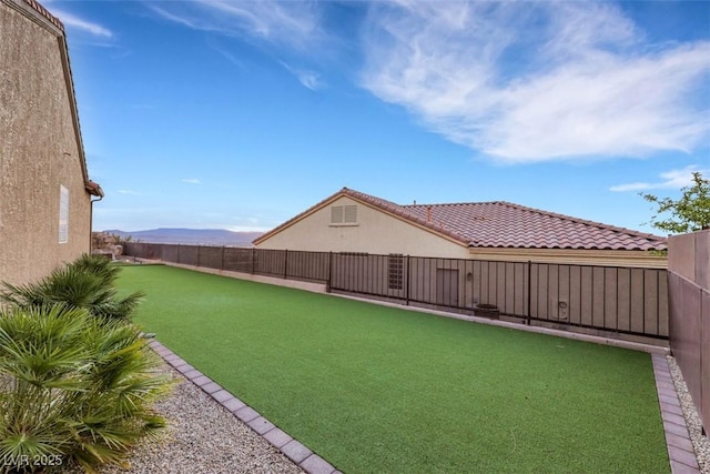 view of yard with a fenced backyard