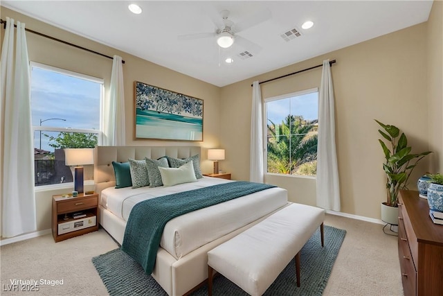 bedroom featuring visible vents, baseboards, recessed lighting, ceiling fan, and light colored carpet