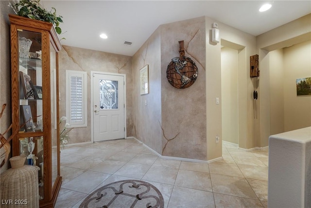 foyer entrance featuring recessed lighting, visible vents, baseboards, and light tile patterned floors