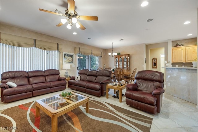 living room with ceiling fan with notable chandelier, light tile patterned flooring, visible vents, and recessed lighting