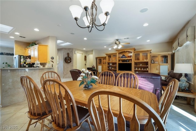 dining area with recessed lighting, light tile patterned flooring, visible vents, and ceiling fan with notable chandelier