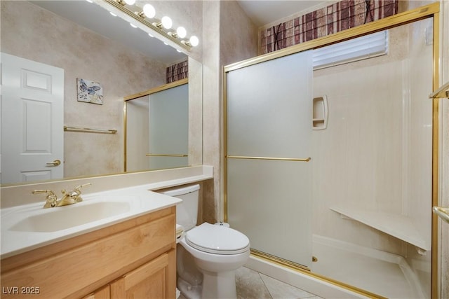 bathroom featuring toilet, a shower with door, tile patterned flooring, and vanity