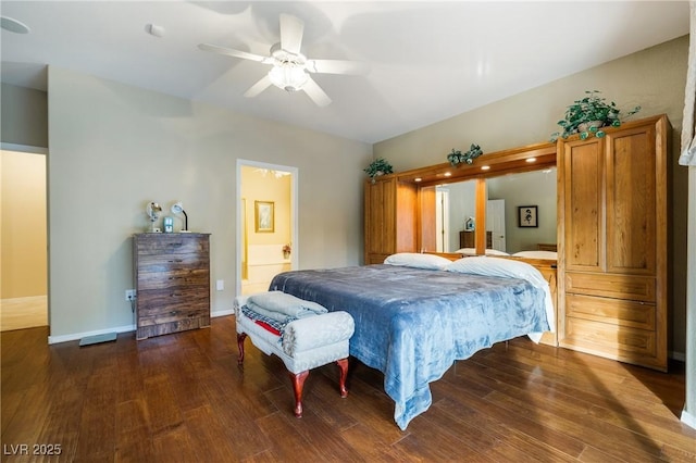 bedroom featuring ceiling fan, connected bathroom, baseboards, and wood finished floors