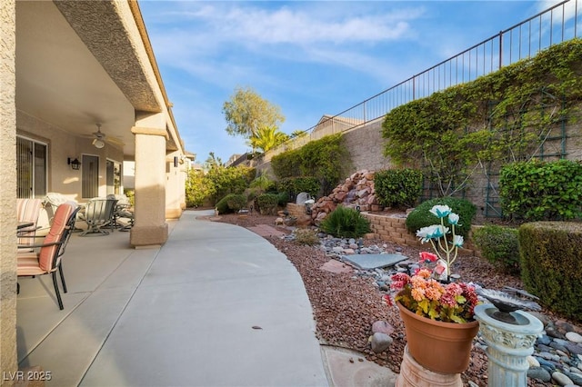 view of patio / terrace featuring a fenced backyard and a ceiling fan