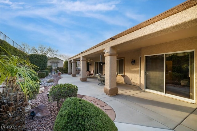 view of patio featuring an outbuilding and outdoor dining space