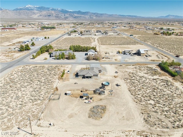 aerial view featuring view of desert, a rural view, and a mountain view