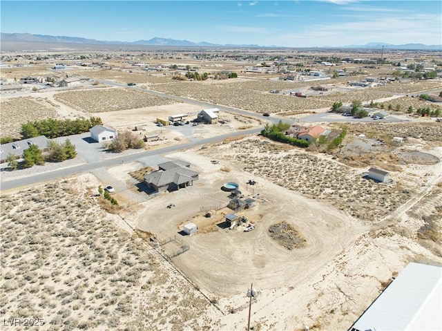 bird's eye view with a desert view and a mountain view