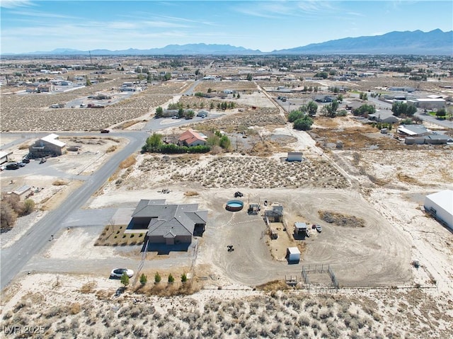 aerial view featuring a mountain view and a desert view