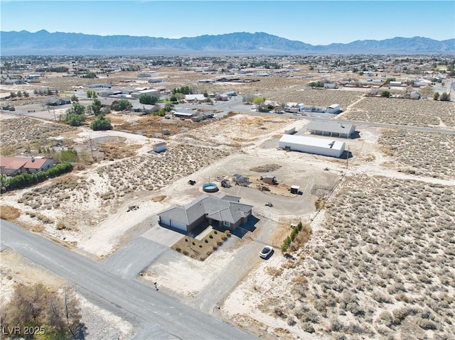 aerial view with a desert view and a mountain view