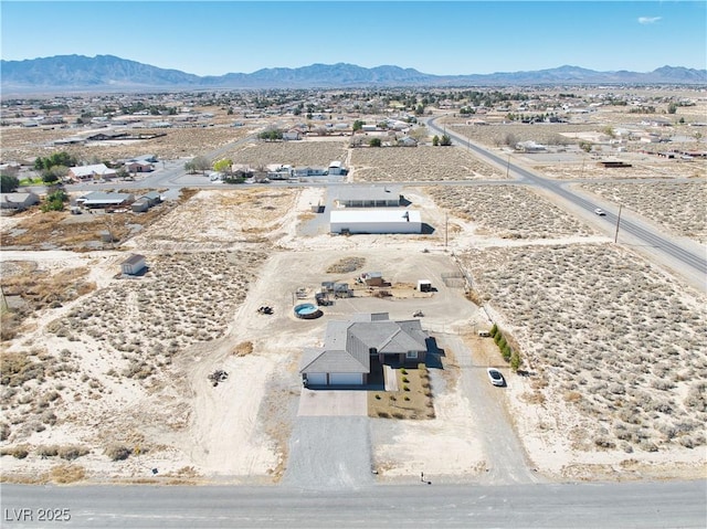 bird's eye view with view of desert and a mountain view