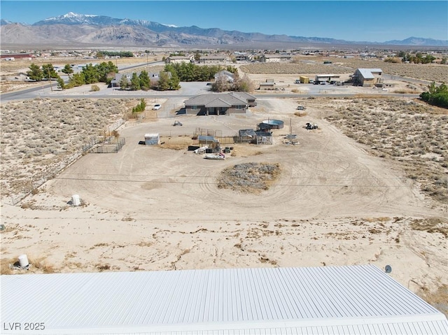 bird's eye view with a mountain view and view of desert