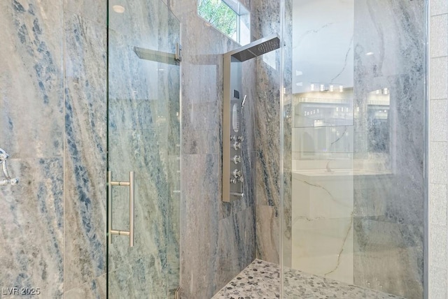 full bath with a marble finish shower