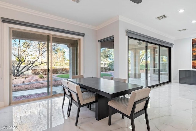 dining space with marble finish floor, visible vents, and ornamental molding