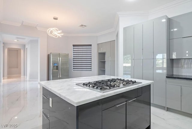 kitchen featuring marble finish floor, appliances with stainless steel finishes, modern cabinets, and gray cabinets