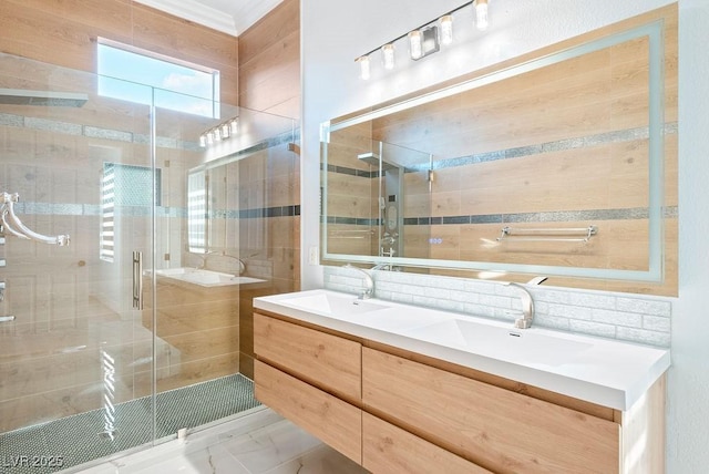 full bath featuring a stall shower, a sink, decorative backsplash, and double vanity